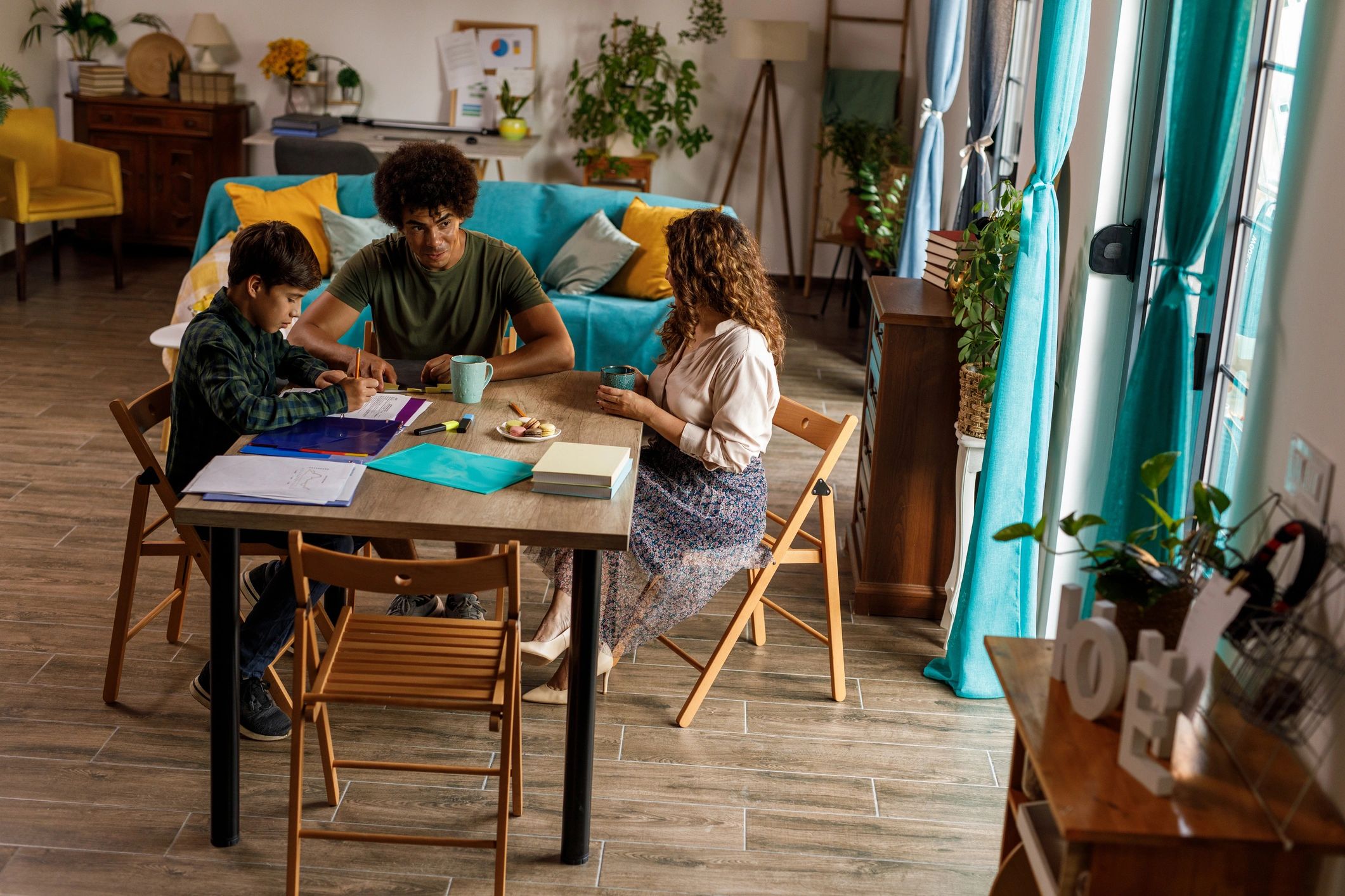 Parents supporting a student with schoolwork at home
